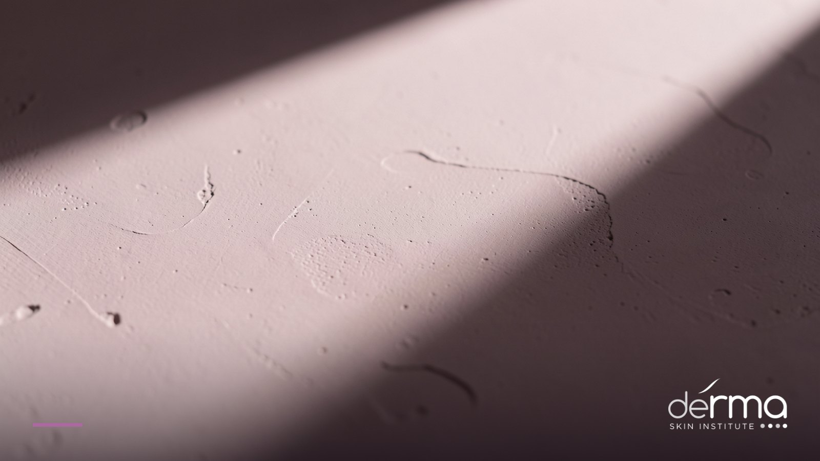 Directional light revealing fine surface texture, representing the topography of acne scarring