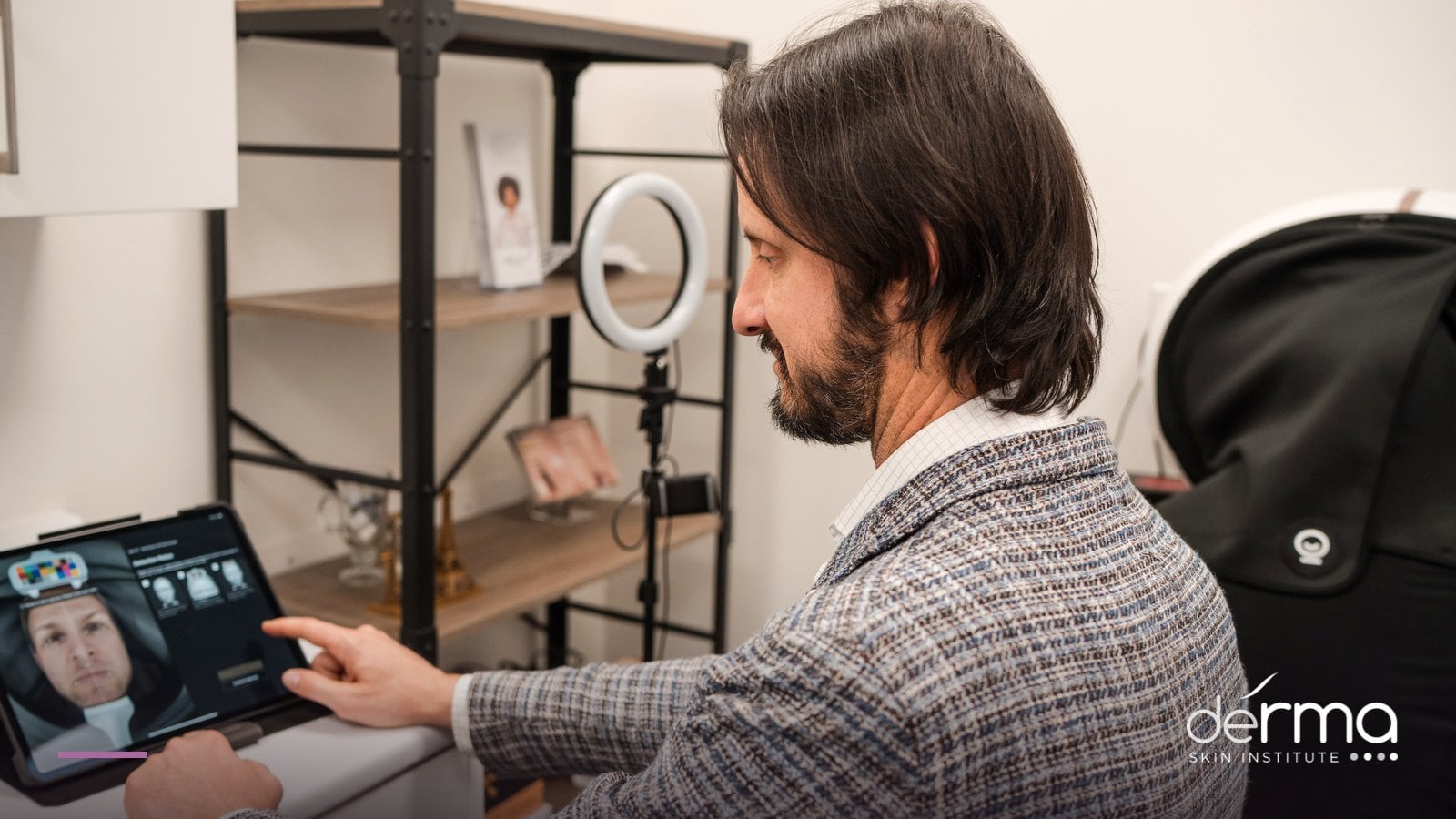 Dr. Dusan Sajic reviewing a digital facial analysis scan at deRMA Skin Institute