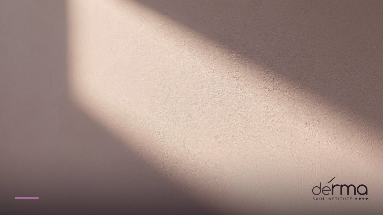 Soft graduated sunlight falling across a neutral surface, representing sun exposure and pigmentation