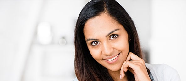 A beautiful woman is smiling after peels & treatments.